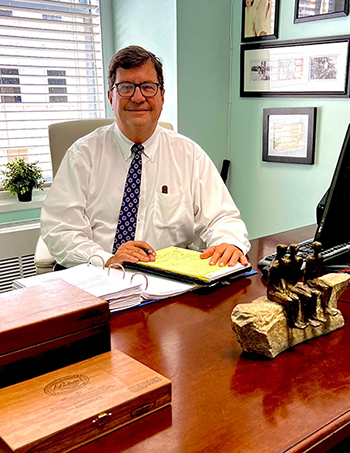 George L. Metcalfe - Socio Director